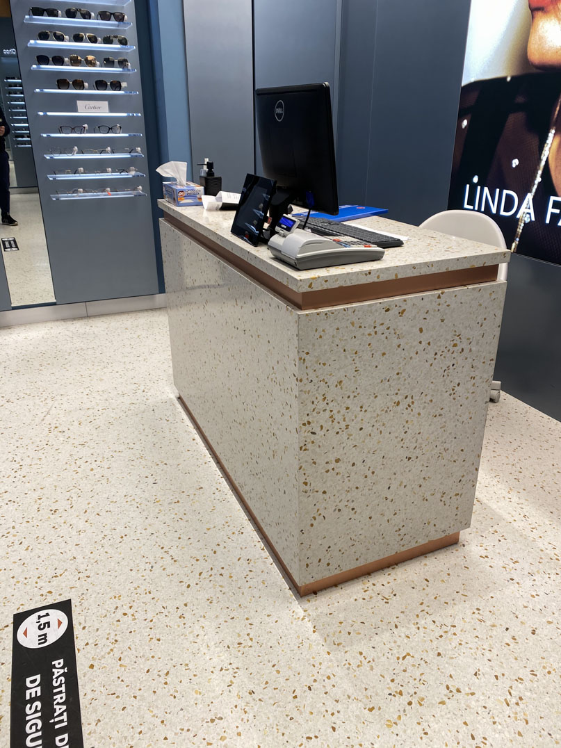 light terrazzo desk and flooring