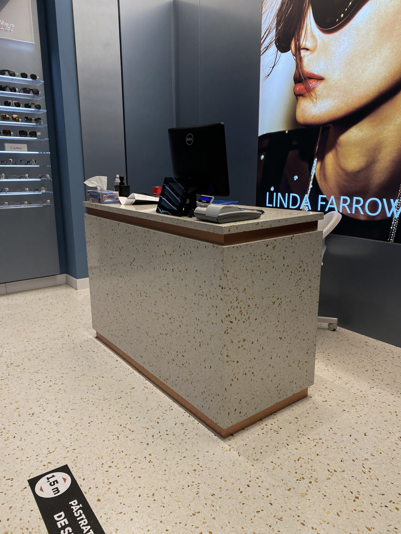 terrazzo cream flooring and desk